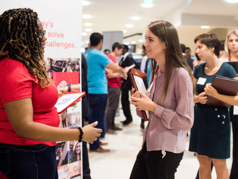 Engineering Expo UT Austin student talking to employer