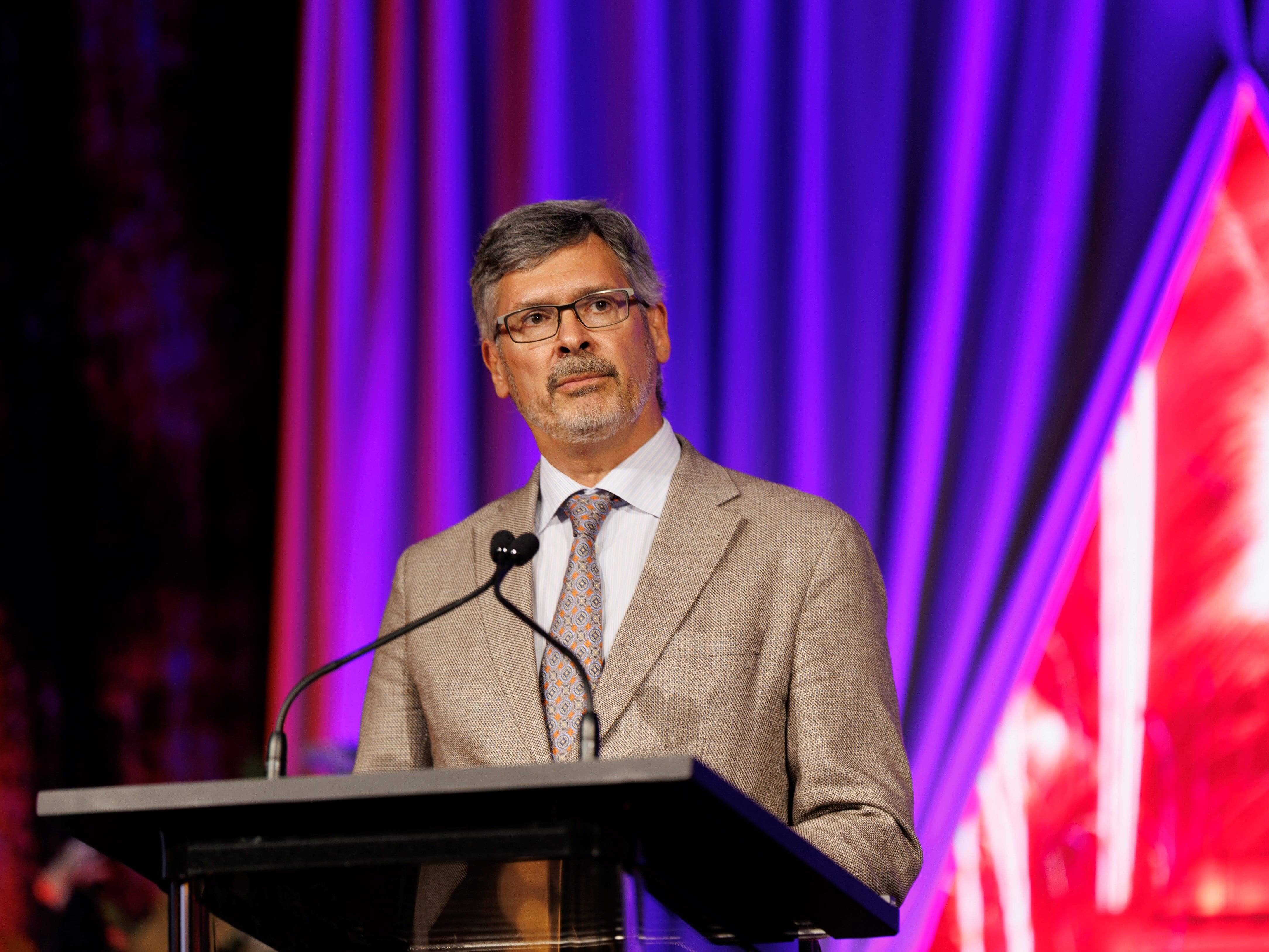 Roger Bonnecaze delivering speech at a podium on stage