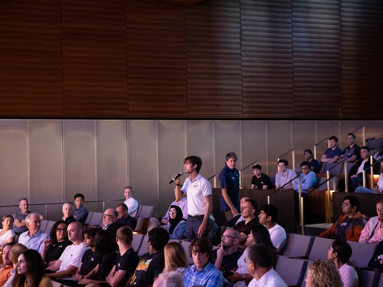 A Texas Engineering student asking a question from the crows at the Launch Texas event