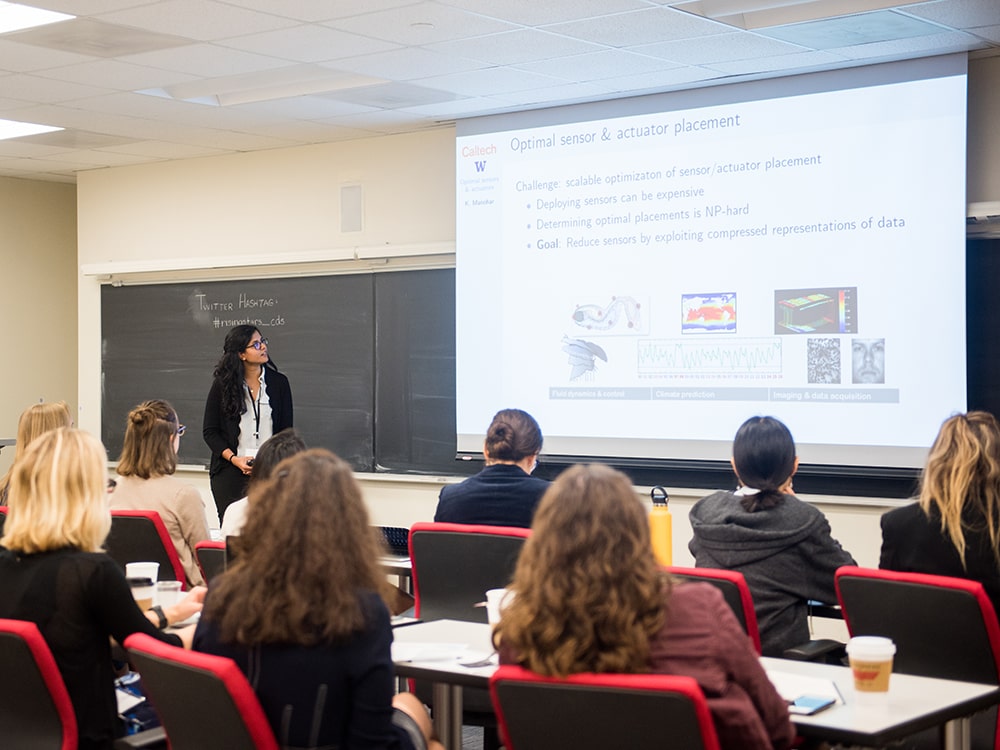 Krithika Manohar presenting with slide show at Rising Stars event