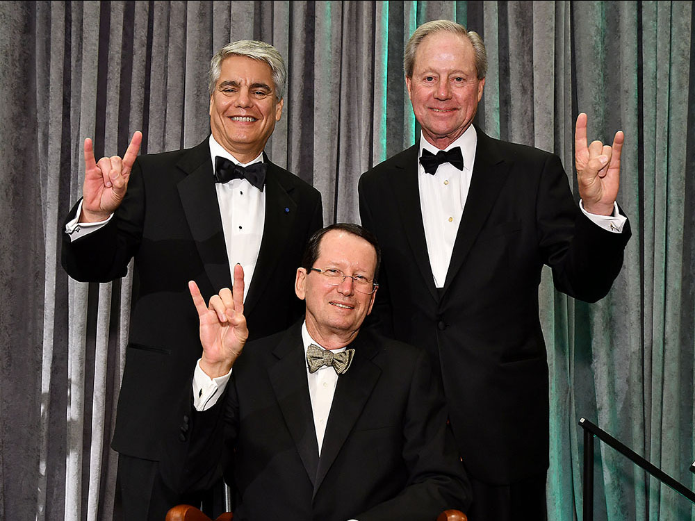 Portrait of UT Austin President Gregory L. Fenves, UT Engineering alumnus Ernie Cockrell and Welch Foundation President Norbert Dittrich (seated) at a reception on Oct. 21.