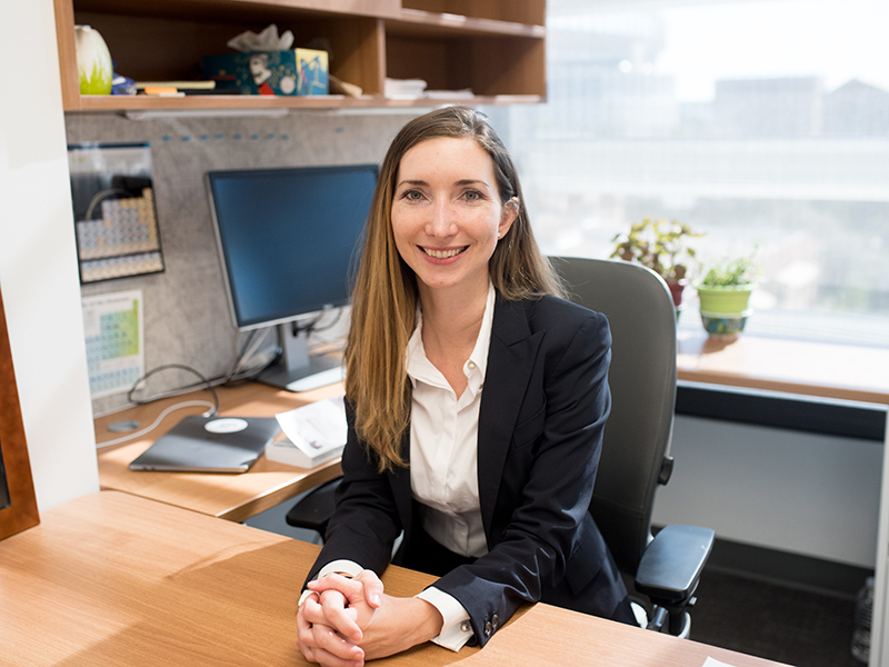 Jean Anne Incorvia smiling in at her desk