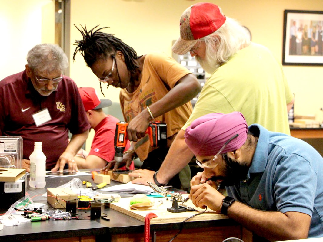 Texas engineers working at a lab table on several projects