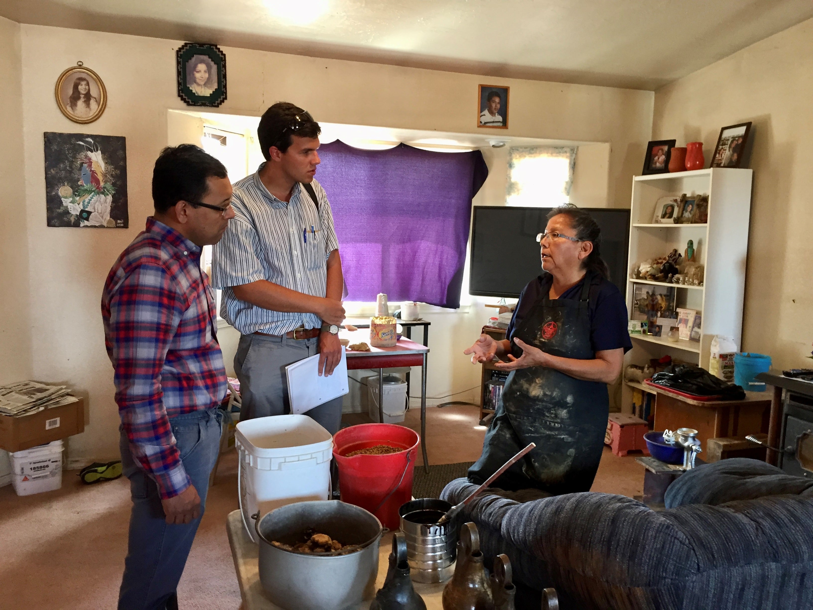 Navid Saleh and Stetson Rowles listening to Deanna Tso talk in her living room