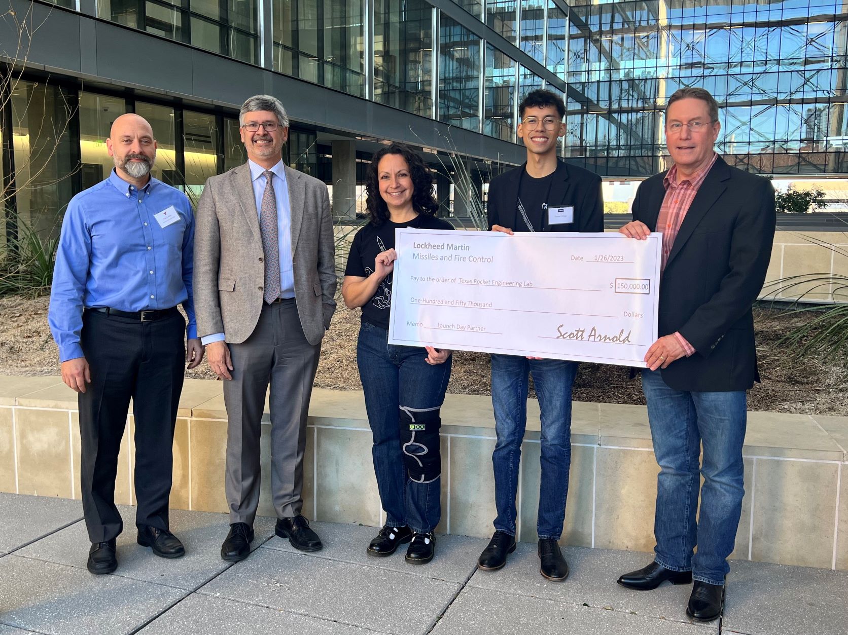 Roger Bonnecaze, Sandy Barker and Lockeed Martin representatives holding check for Texas Rocket Engineering Lab