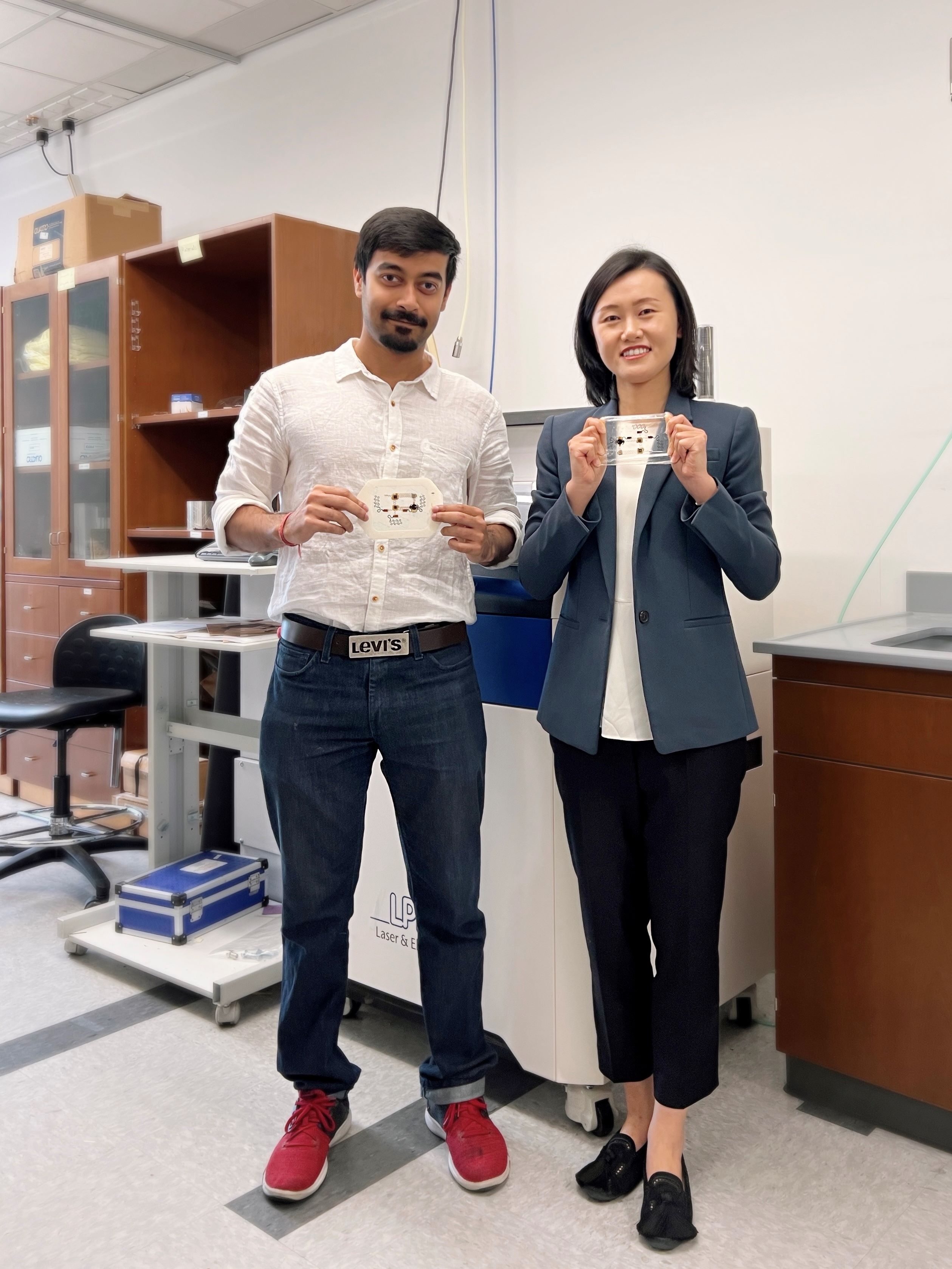 Nanshu Lu holding holding chest e-tattoo prototype