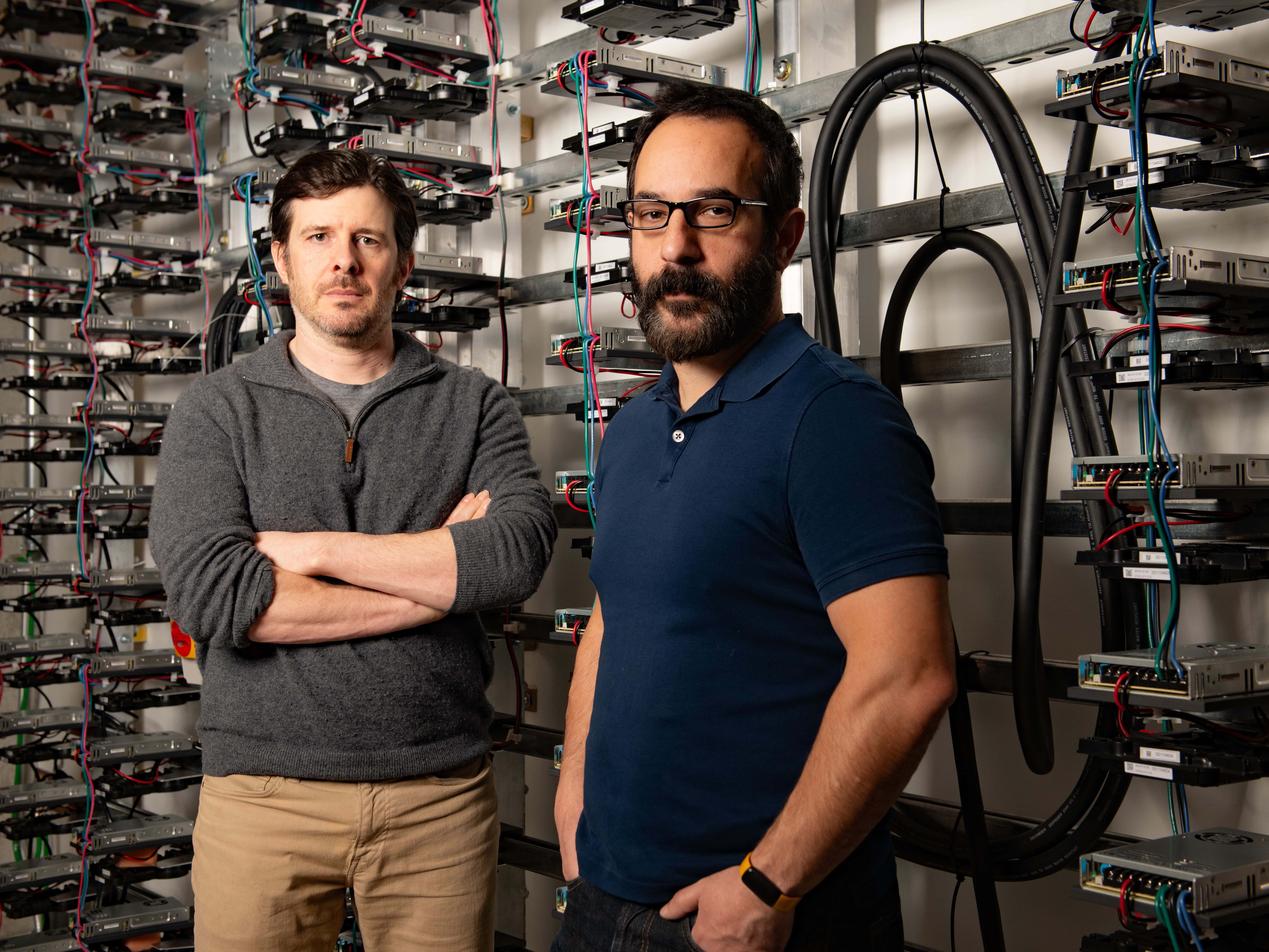 Texas Engineers Alex Dimakis and Adam Klivans with AI servers