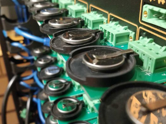A battery cycler in Arumugam's Manthiram's lab tests multiple coin cells at the same time.
