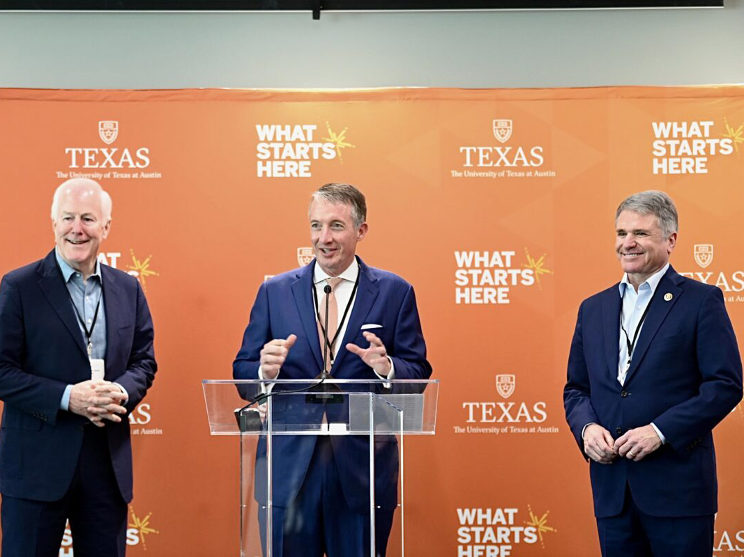 UT Austin President Jay Hartzell speaking at podium