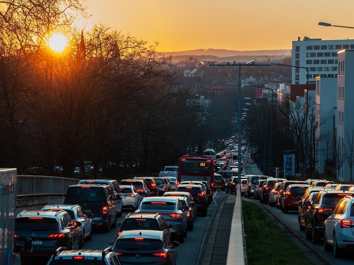 Roads of cars in traffic at sunset