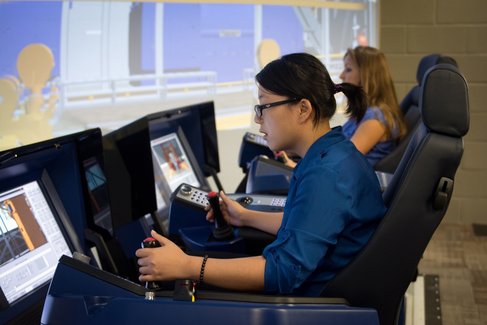 students operating simulation equipment